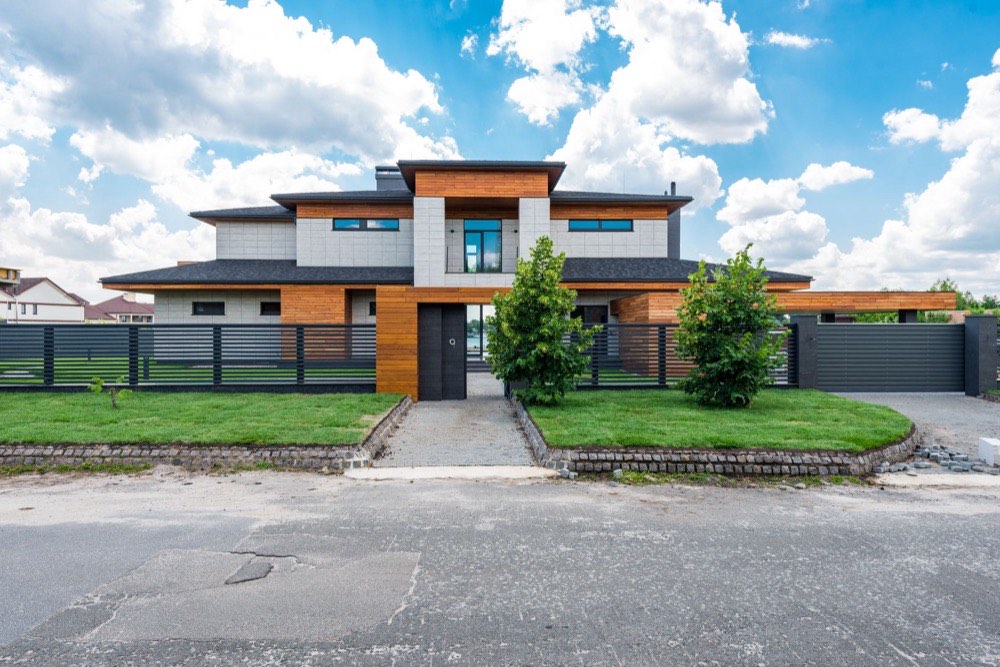 Contemporary two story home frontage with driveway