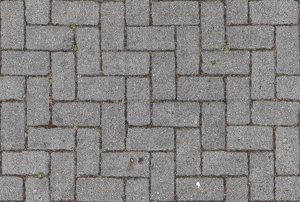 Interlocking concrete pavers laid in a running bond pattern